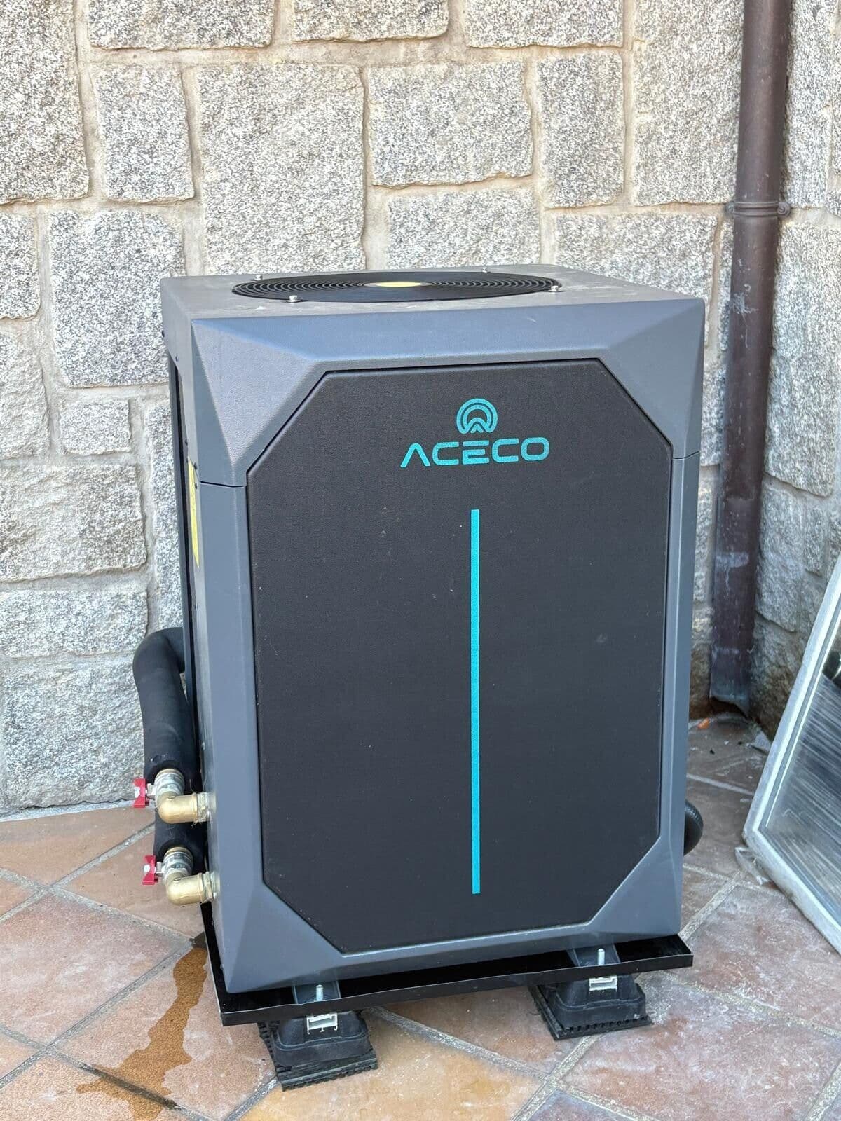 Aerotèrmia ACECO instal·lada davant d'una paret de pedra